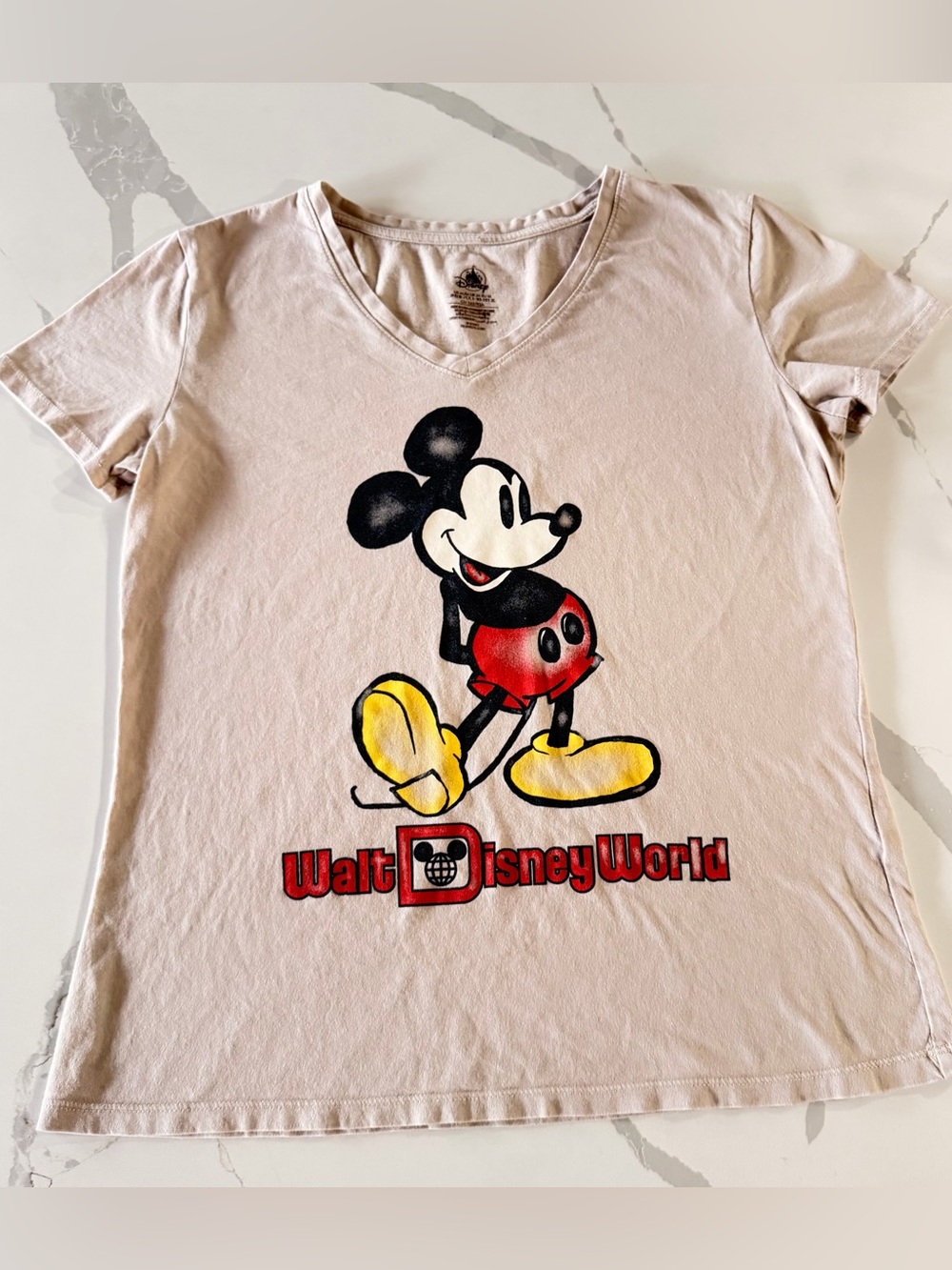Disney Pink V-Neck Mickey Graphic Tee with Red & Yellow Accents